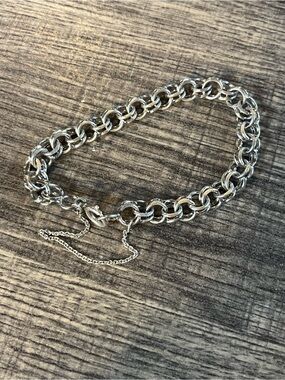 Sterling silver charm bracelet with safety chain